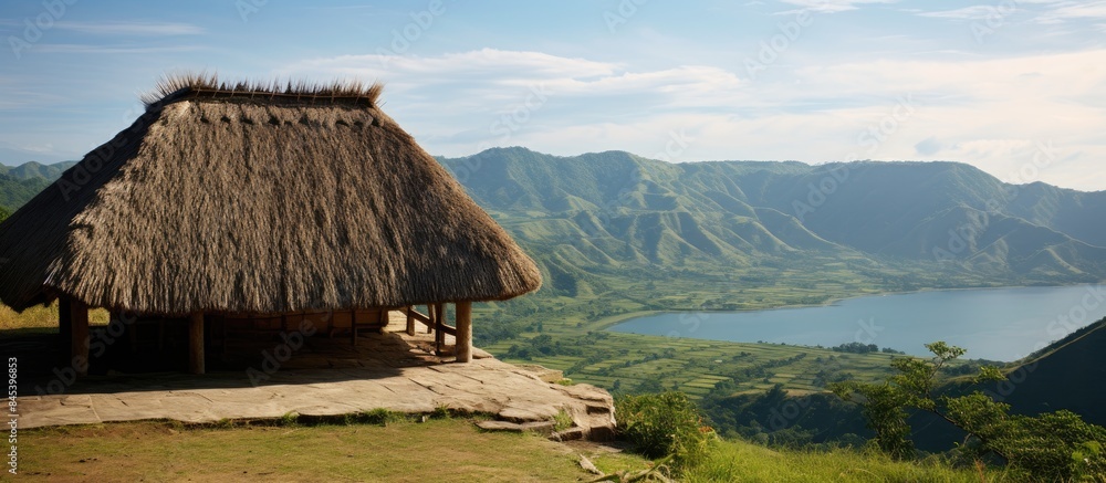 Poster thatched roof with hill view from lombok. creative banner. copyspace image