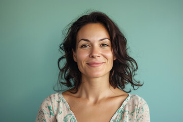 A close up portrait of a woman with a subtle smile