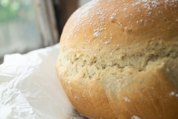 Homemade round bread close-up. Bread is made at home