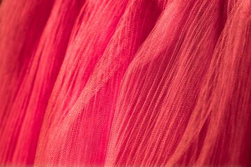 closeup of orange corrugated organza textured background
