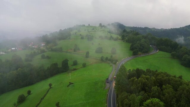 road in a beskid mountains on a rainy foggy clowdy day