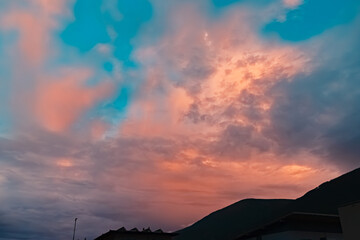 Alpine sunset or sundowner with dramatic clouds at Pettnau, Innsbruck, Tyrol, Austria