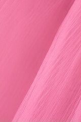 closeup of pink corrugated organza textured background