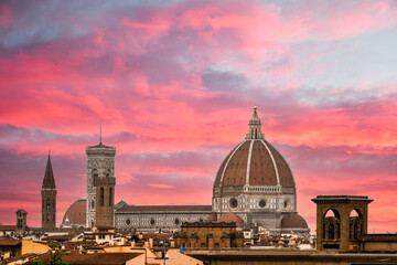 Naklejka premium Cathedral of Santa Maria del Fiore with the Giotto Bell Tower and the Brunelleschi Dome against a spectacular sunset sky, Florence, Tuscany, Italy
