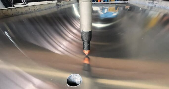 Plasma cutting. Plasma cutter work at the factory. The plasma cutter will cut the part. The process of cutting a metal part with a plasma cutter