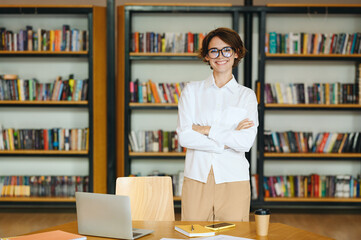 Young confident fun happy successful employee business woman she wear glasses white shirt casual...