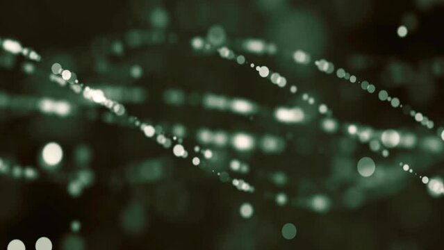 The side of intertwining round particles on a green background