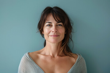 A close up portrait of a woman with a subtle smile