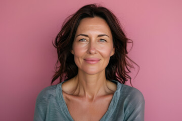 A close up portrait of a woman with a subtle smile