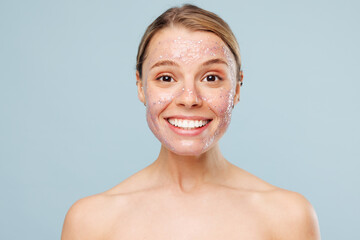 Beautiful half naked topless young woman with nude make up, pink jelly-like mask with glitters...