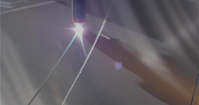 The plasma cutter will cut the part. The process of cutting a metal part with a plasma cutter. Plasma cutting Plasma cutter work at the factory.