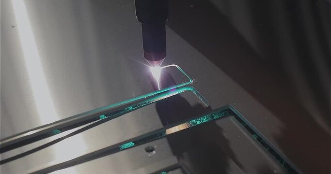 The plasma cutter will cut the part. The process of cutting a metal part with a plasma cutter. Plasma cutting Plasma cutter work at the factory.