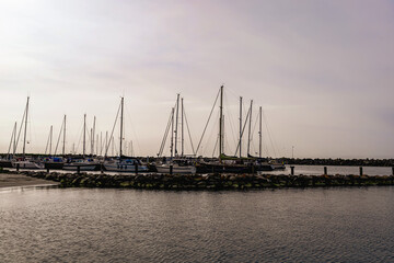 Fototapeta premium Sea pier with boats and yachts at sunset. Bornholm, Denmark