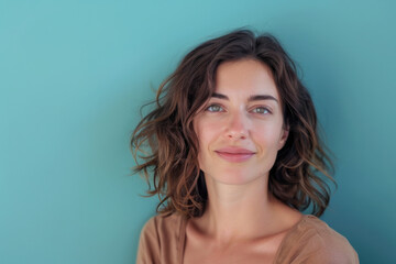 A close up portrait of a woman with a subtle smile