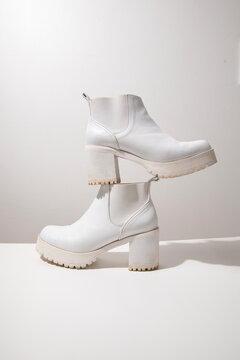 Elegant White Leather Platform Heel Boots on Display