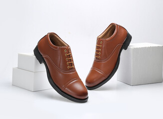tan leather formal uniform shoes isolated on white background