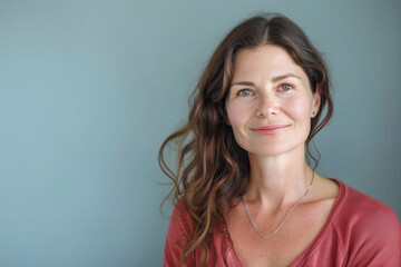 Fototapeta premium A close up portrait of a woman with a subtle smile