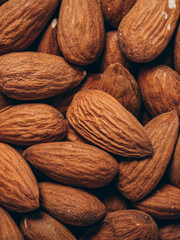 Almond background closeup. Almonds top view. Whole almond nuts flat lay