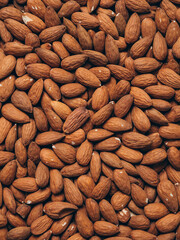 Almond background. Almonds top view background. Whole almond nuts flat lay