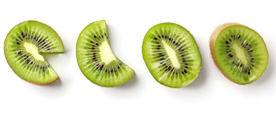 Fototapeta premium Sliced kiwi fruit segments isolated on white background.