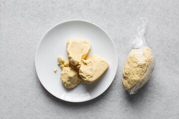 Overhead view of nigerian akamu or pap paste, process of making akamu, flatlay of process of making nigerian akamu ogi pap or corn pudding