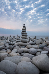 stack of stones on pebble beach