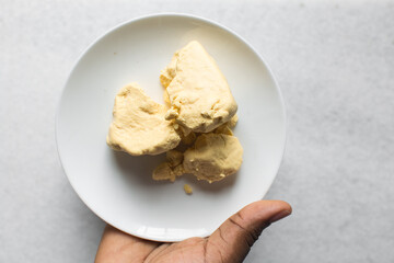 Overhead view of nigerian akamu or pap paste, process of making akamu, flatlay of process of making nigerian akamu ogi pap or corn pudding