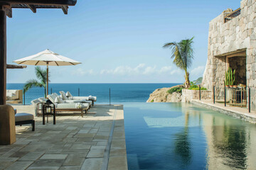 Obraz premium Sunny Luxury Beachfront Poolside Retreat with Infinity Ocean View and Modern Amenities
