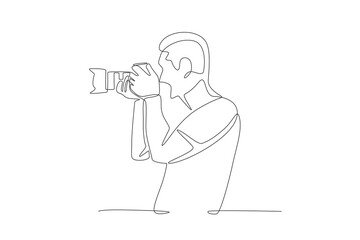 Male photographer taking photos. World photography day concept one-line drawing