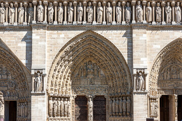 Fragment of a sculptural panel of a portal of the main facade of Notre-Dame de Paris with the image of a scene of the Last Judgement, Paris, France