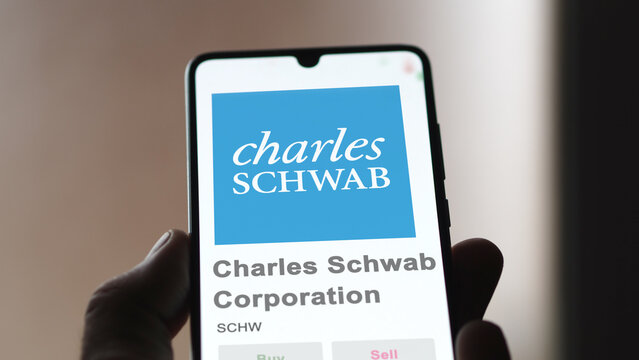 April 09th 2024 , Westlake, Texas. Close up on logo of Charles Schwab Corporation on the screen of an exchange. Charles Schwab Corporation price stocks, $SCHW on a device.