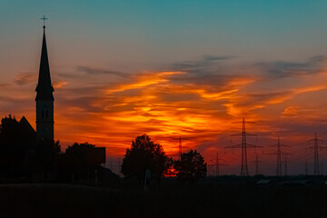 Sunset with a church silhouette near Wallerdorf, K&uuml;nzing, Deggendorf, Bavaria, Germany