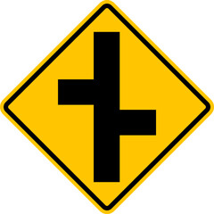 Unregulated intersection with an adjacent road. On both sides. Road merge sign. Road junction. A junction where one street or road intersects another. Diamond road sign. Warning yellow road sign.