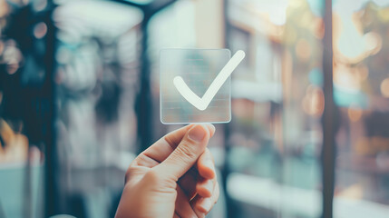 Hand holding Sign of the checkmark.
