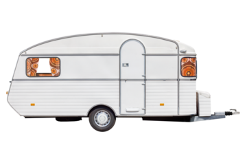 Vintage seventies white caravan with flower curtains