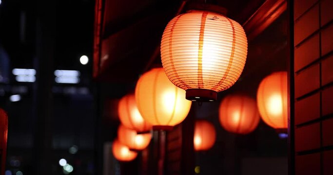 A night neon cityscape including the paper lantern at the downtown in Tokyo close up