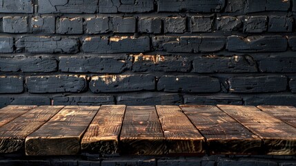 Vintage style wooden table top against dark brick wall with space for your branding Ideal for product displays