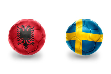 Obraz premium football balls with national flags of sweden and albania ,soccer teams. on the white background.