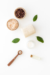 Flat lay of organic spa care cosmetic with coffee soap and scrub