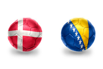 football balls with national flags of bosnia and herzegovina and denmark ,soccer teams. on the white background.