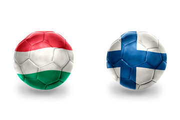 football balls with national flags of finland and hungary ,soccer teams. on the white background.