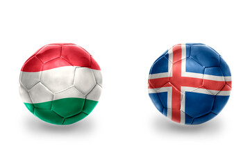 Obraz premium football balls with national flags of iceland and hungary ,soccer teams. on the white background.