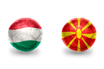 football balls with national flags of macedonia and hungary ,soccer teams. on the white background.