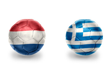 Obraz premium football balls with national flags of greece and netherlands ,soccer teams. on the white background.