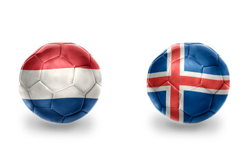 Obraz premium football balls with national flags of iceland and netherlands ,soccer teams. on the white background.