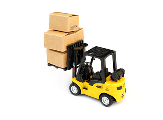 Yellow forklift track model with many carton boxes isolated on white.	