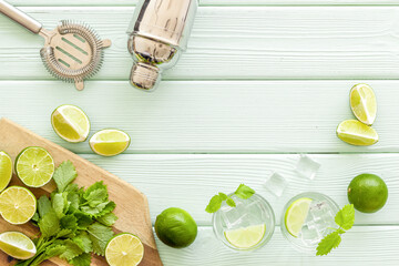 Fresh green mint with lime for refreshing cocktail mojito, top view