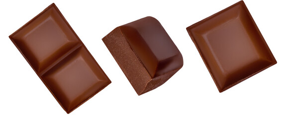 Broken chocolate bar pieces isolated on white background. Dark Chocolate chunks Top view. Flat lay....