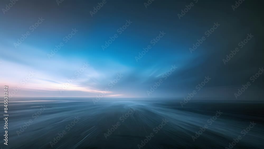 Poster the rhythmic movement of the wind turbines creating a mesmerizing pattern against the horizon.