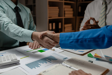 they are doing handshake in the office because they just signed the contract to be a partner of...